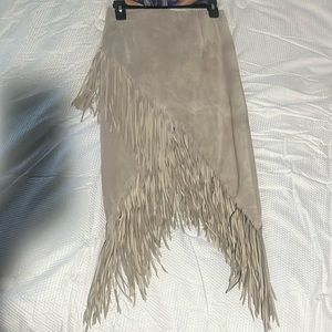The brand-Intermix-fringed skirt. Leather fabric textile. Light brown color.